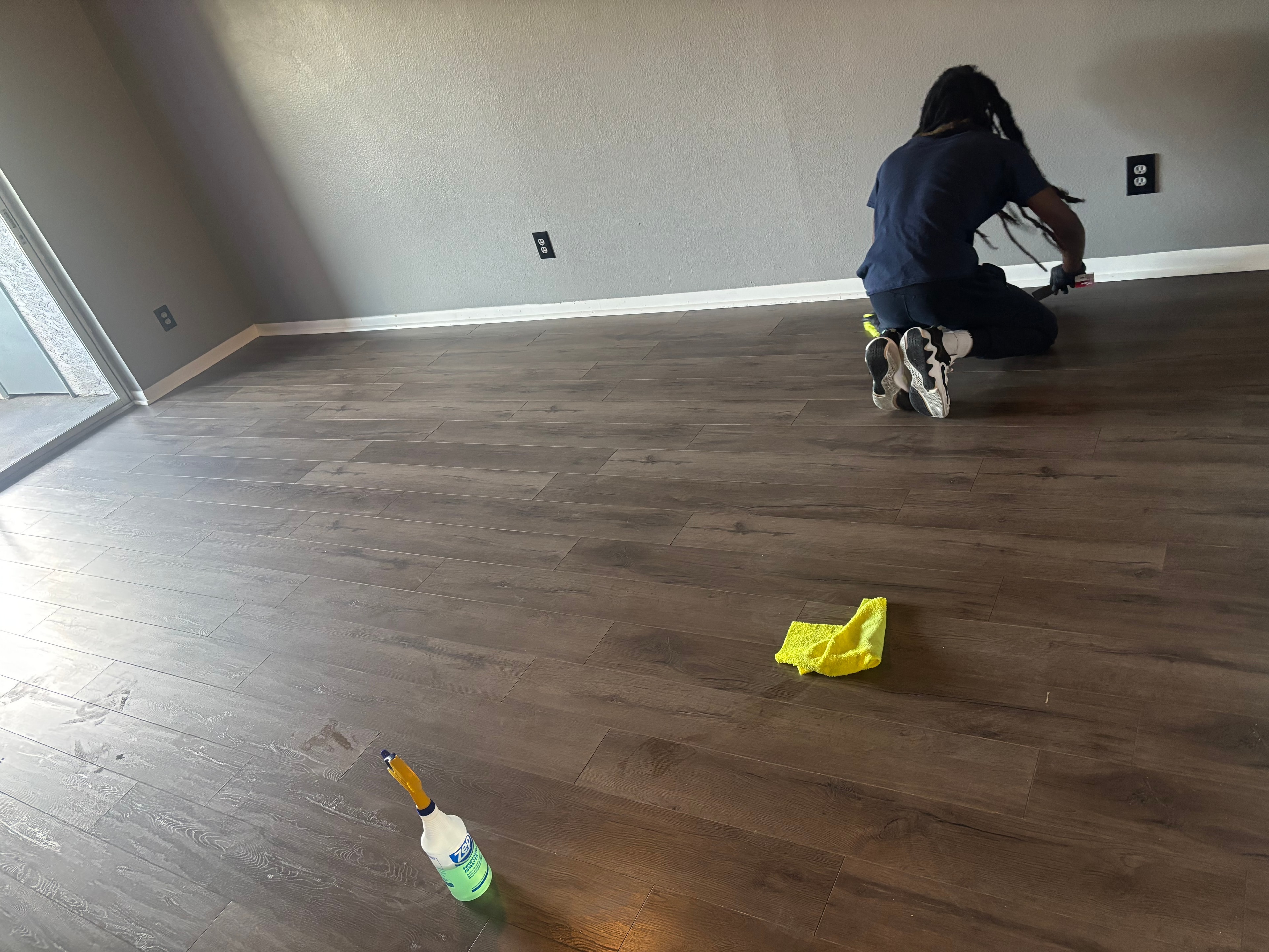NorthStar team member cleaning tile floors
