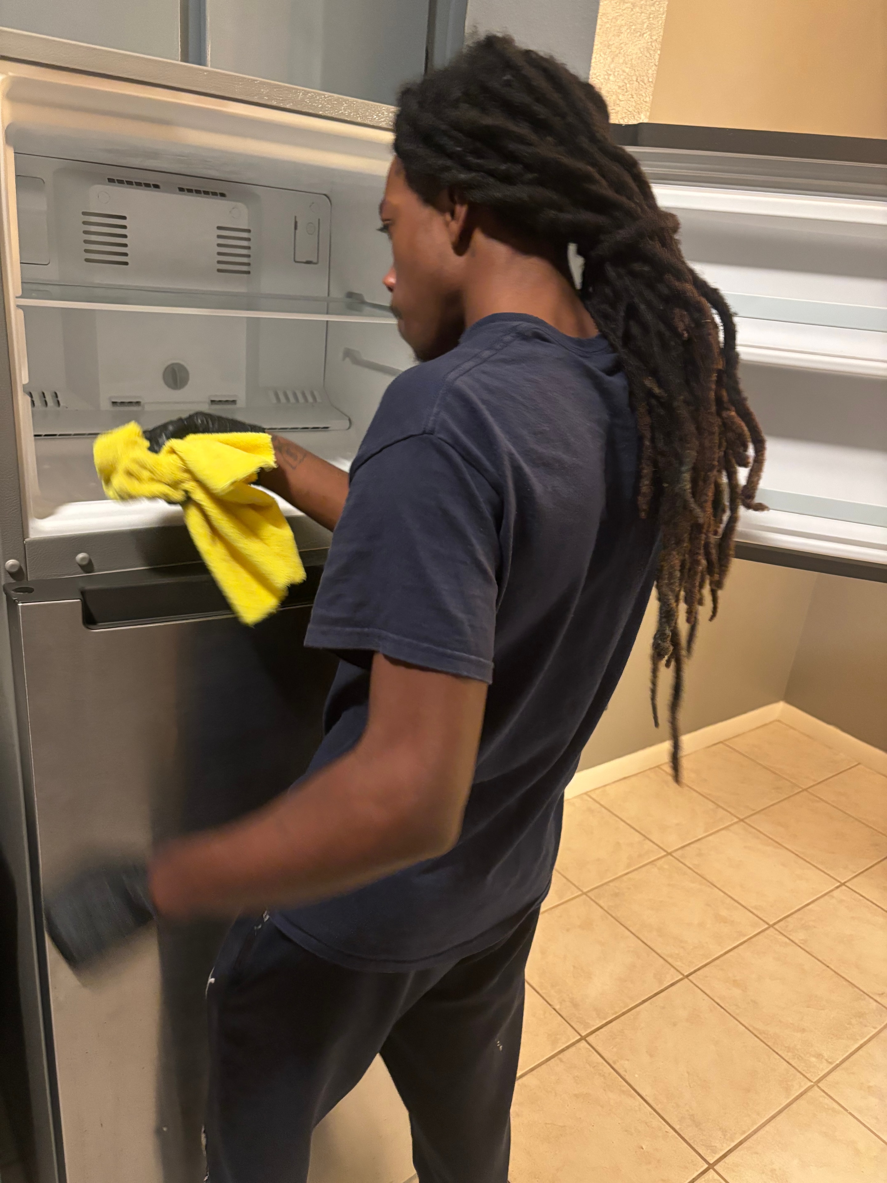 NorthStar team member deep cleaning oven interior