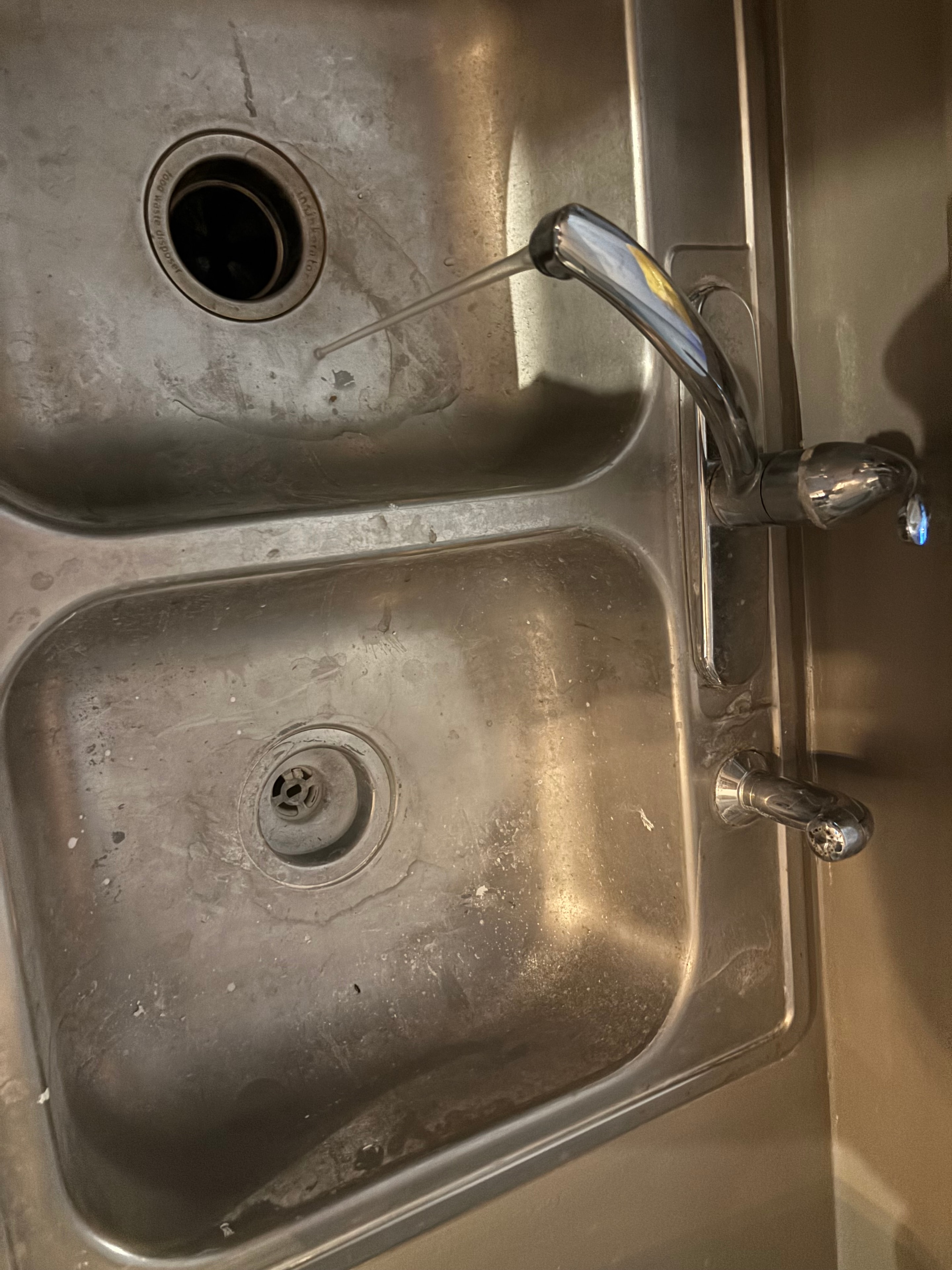 Sink and faucet polished clean after cleaning