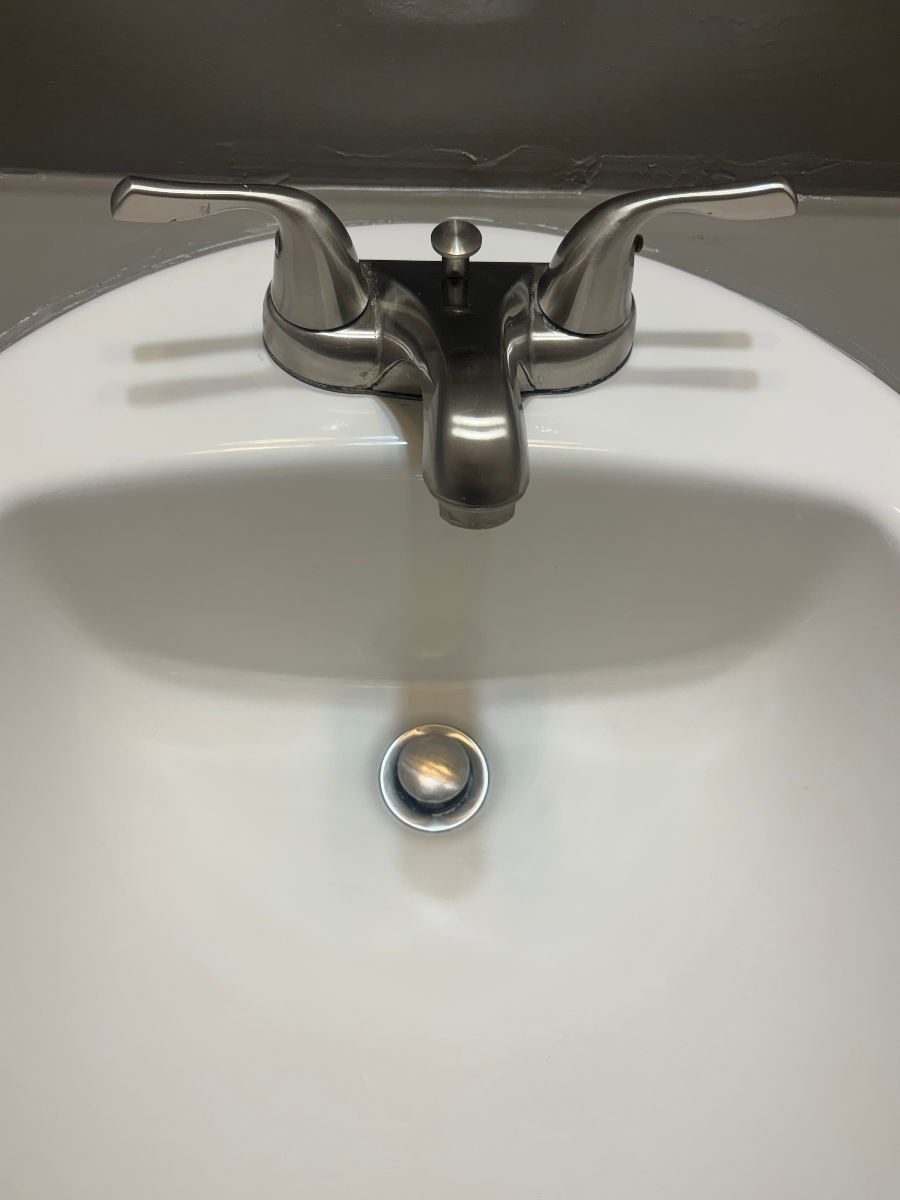 Sink faucet with heavy buildup before cleaning